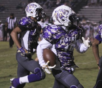 Roger Wilson returns a punt for a touchdown.